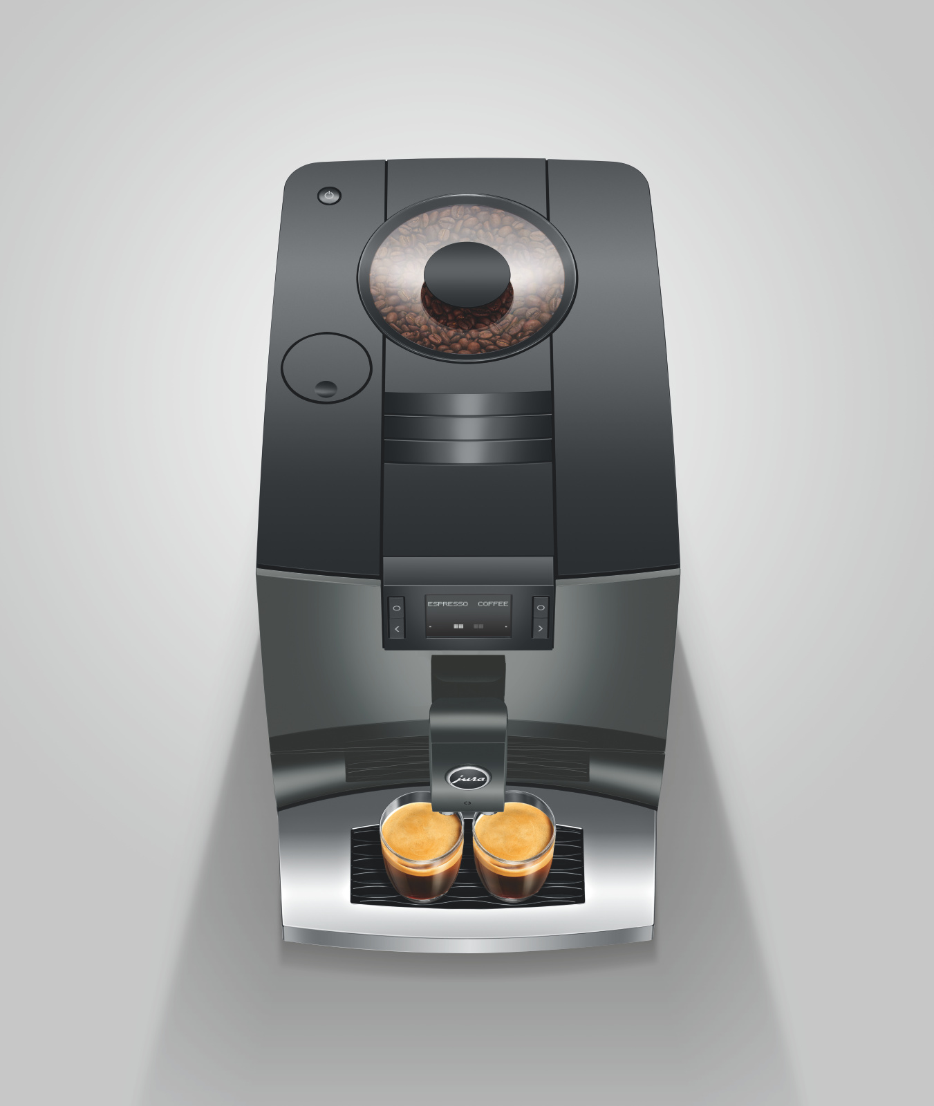 Jura C3 Piano Inox zaprezentowany od góry z widokiem na zbiornik ziaren oraz z 2 szklankami espresso